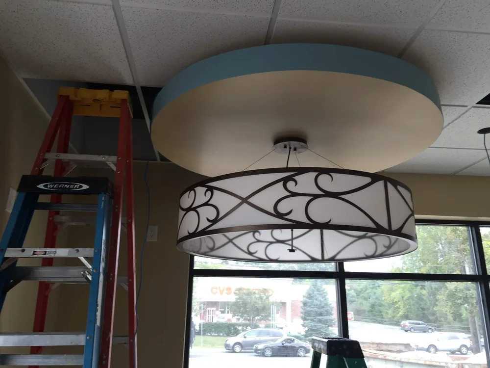 Decorative drum chandelier at a storefront by Elite Electric