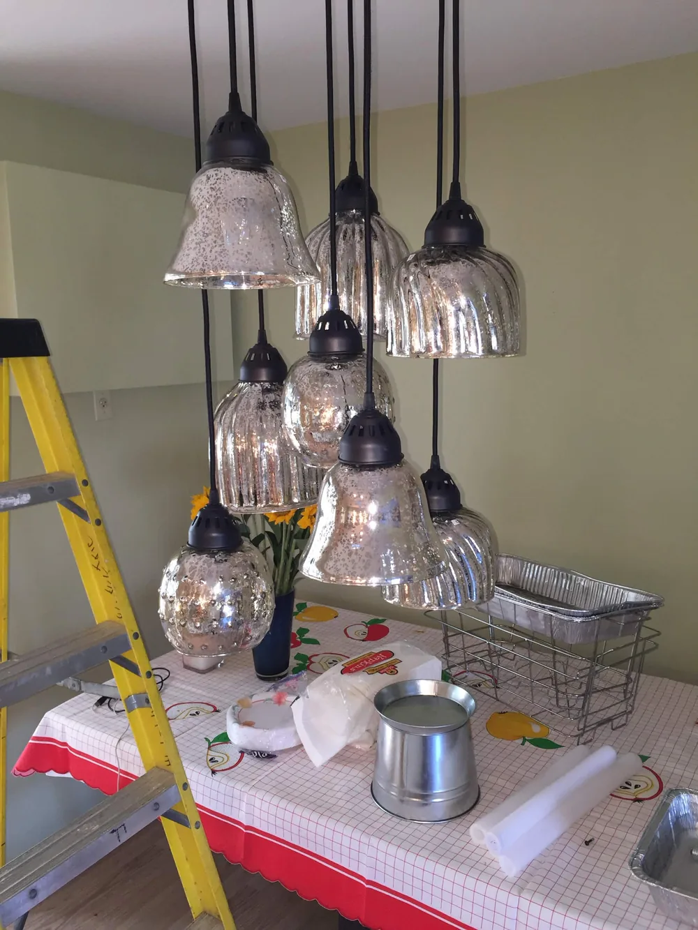 Pendant light cluster installation at a storefront by Elite Electric