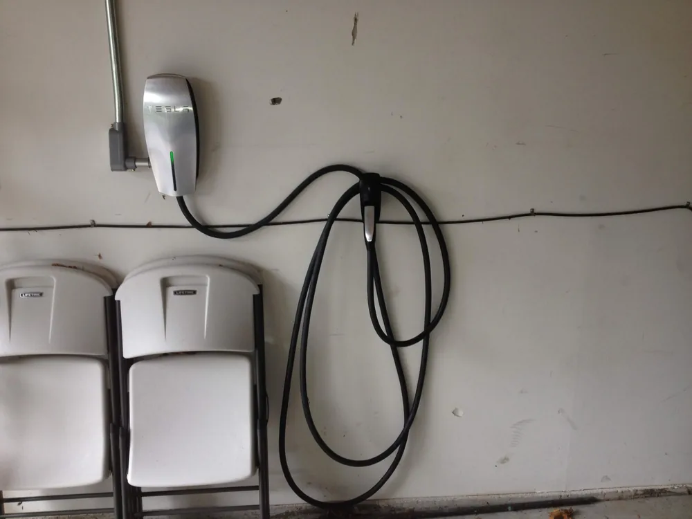 EV charger installed in a garage by Elite Electric