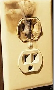 A burnt receptacle, the kind of hazard our troubleshooting finds and fixes